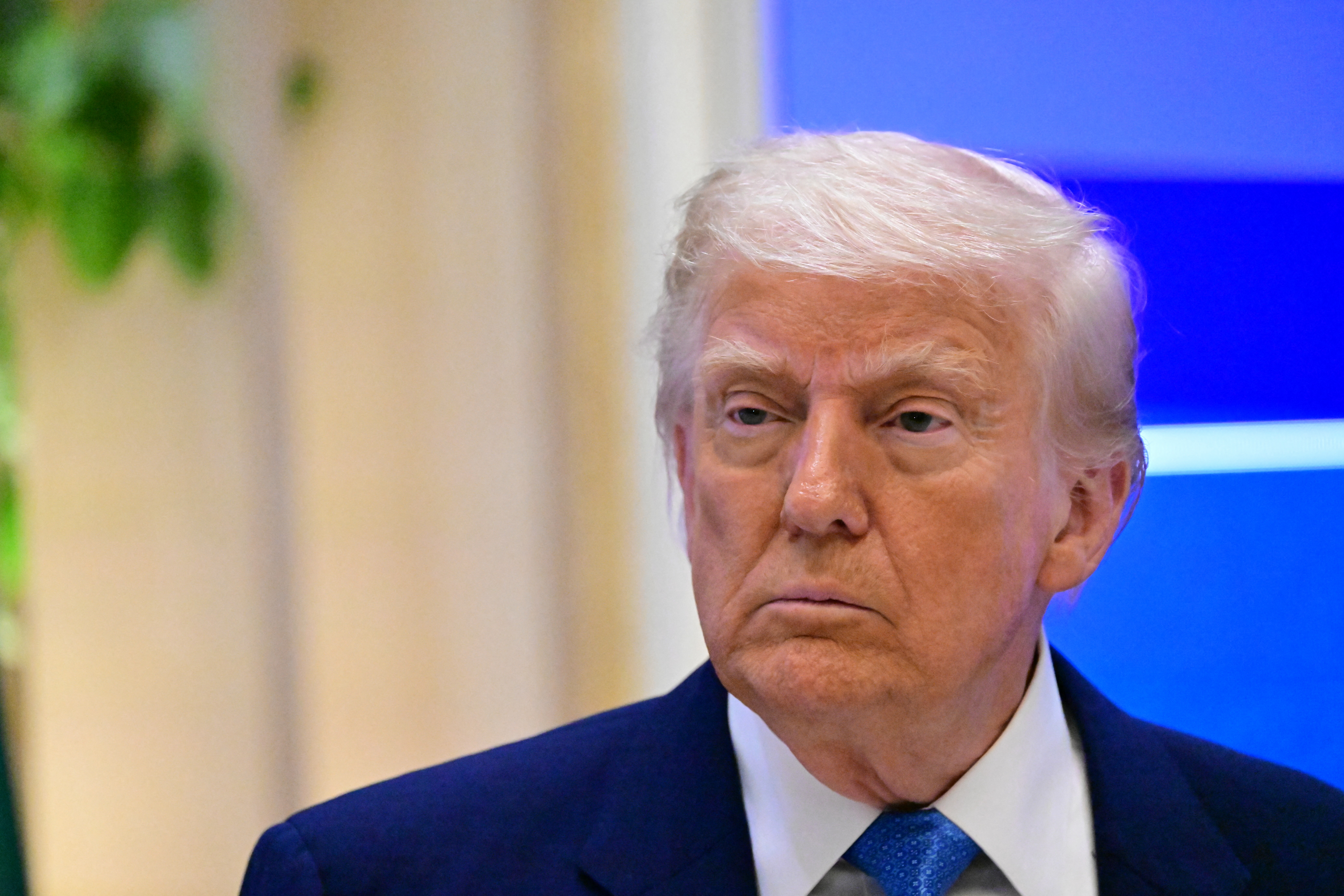 US President Donald Trump attends a business forum in Abu Dhabi on May 16, 2025. Trump capped his Gulf tour in Abu Dhabi after signing another raft of multi-billion-dollar deals, while also securing a $1.4 trillion investment pledge from the UAE.