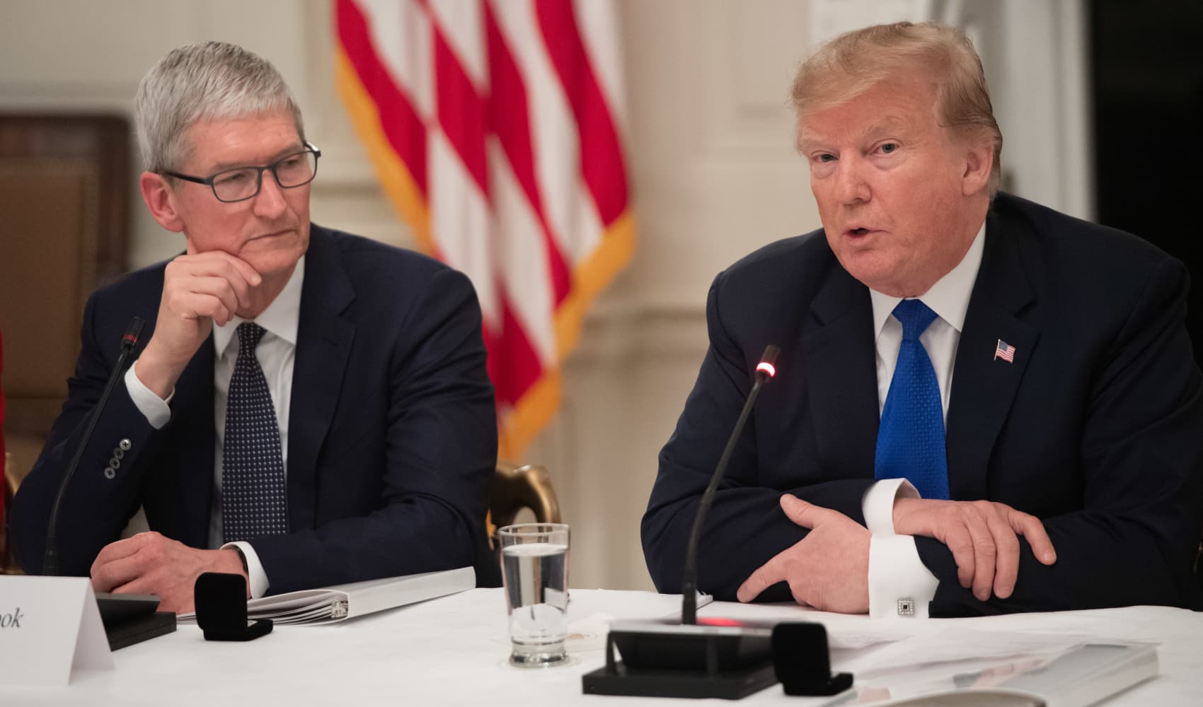 Donald Trump speaks alongside Apple CEO Tim Cook (L) during the first meeting of the American Workforce Policy Advisory Board in the State Dining Room of the White House in Washington, DC, March 6, 2019.