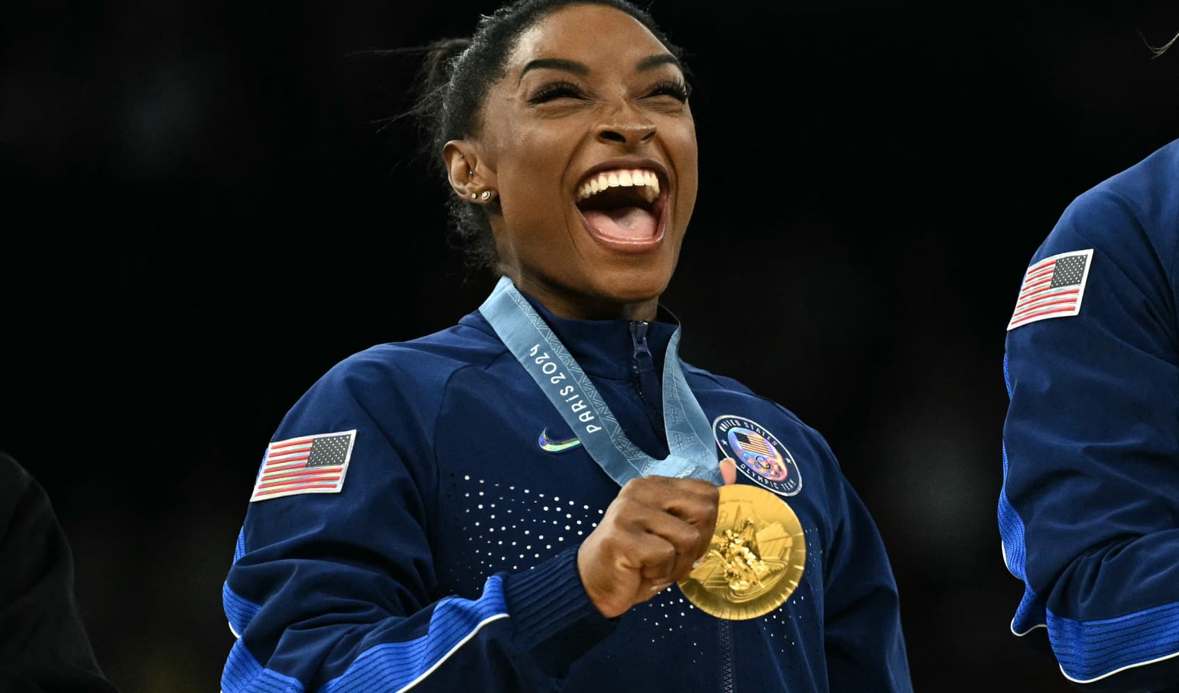 Simone Biles poses with the gold medal during the podium ceremony at the 2024 Paris Olympic Games at the Bercy Arena in Paris on July 30, 2024.